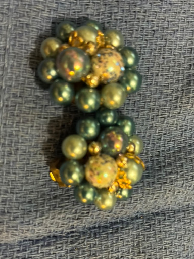 Vintage cluster clip-on earrings with green beads and gold-tone accents, made in Japan