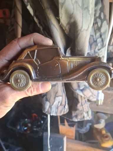 Metal coin bank depicting a 1953 MG sports car by Banthrico