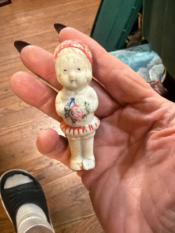 Bisque porcelain penny doll figurine with hand-painted floral decoration, likely Japanese origin