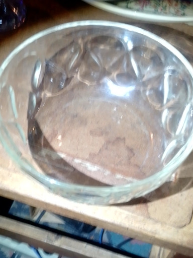 Clear glass mixing bowl with teardrop or thumbprint pattern by Pyrex