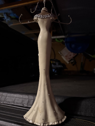 ceramic jewelry display stand in the form of an elegant ball gown dress
