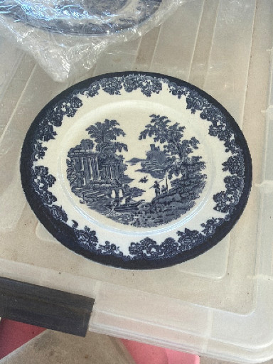 Ceramic transferware plate with blue pastoral scene
