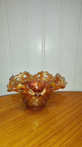 Carnival glass bowl with basket weave pattern in marigold iridescent finish by Fenton
