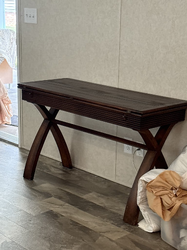Dark cherry wood console table with X-base legs and slatted expandable top