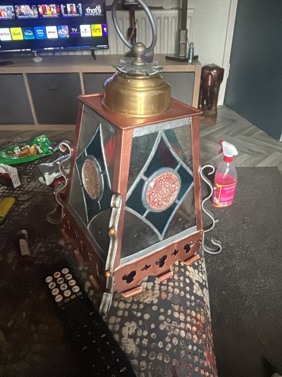 Brass and stained glass lantern with decorative copper frame