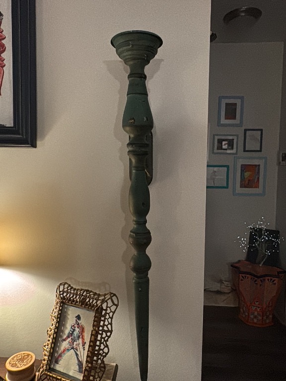 Painted wood wall-mounted candle sconce with turned spindle design