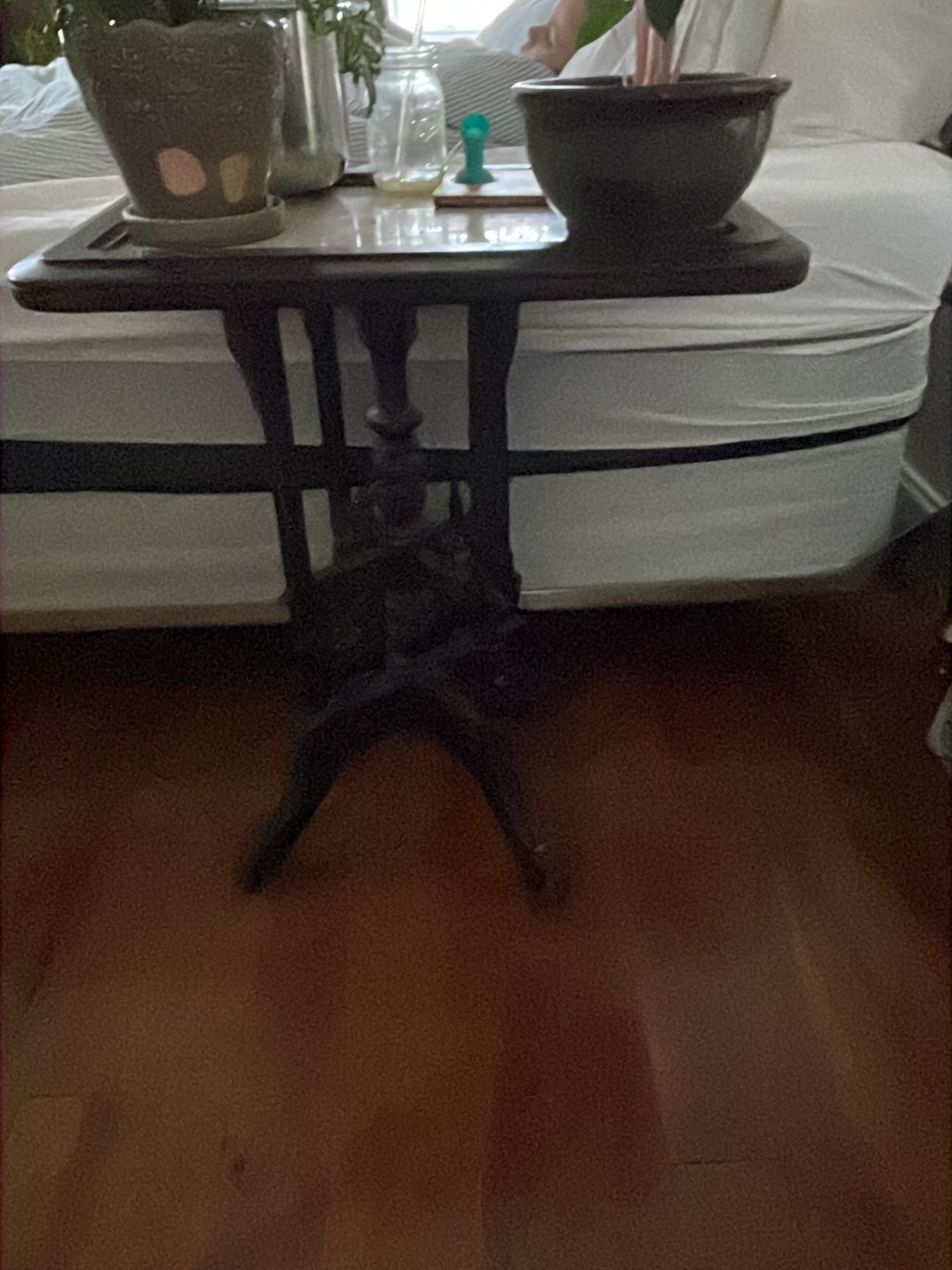Wooden Victorian-style side table with tripod base