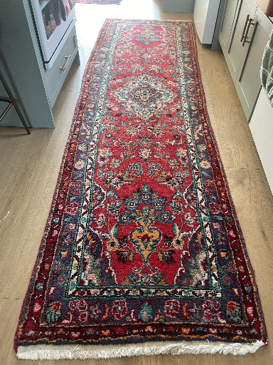Hand-knotted wool Persian Hamadan runner rug with red field and colorful floral medallion design