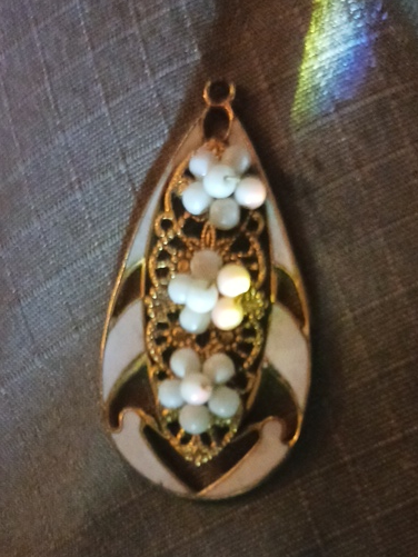 Gold-tone teardrop pendant with mother-of-pearl inlay and seed pearl accents