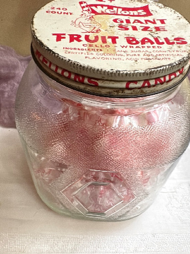 Glass candy jar with vintage 'Wellons Giant Size Fruit Walls' lid