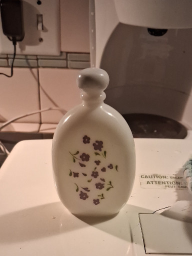 Milk glass perfume bottle titled 'Lavender Cologne' by Avon