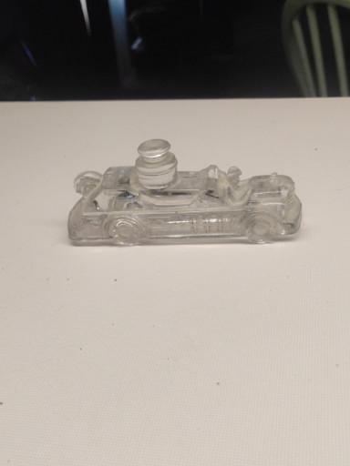 Clear glass candy container in the form of a fire engine truck, manufactured by Victory Glass Company