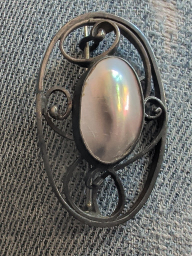 Sterling silver brooch with blister pearl cabochon in Arts and Crafts style