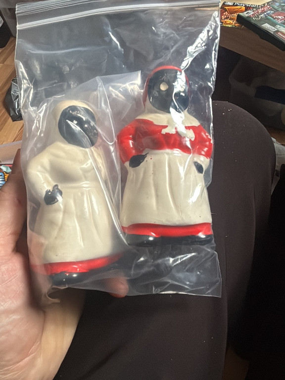 Ceramic salt and pepper shakers depicting 'Aunt Jemima' and 'Uncle Moses' figures