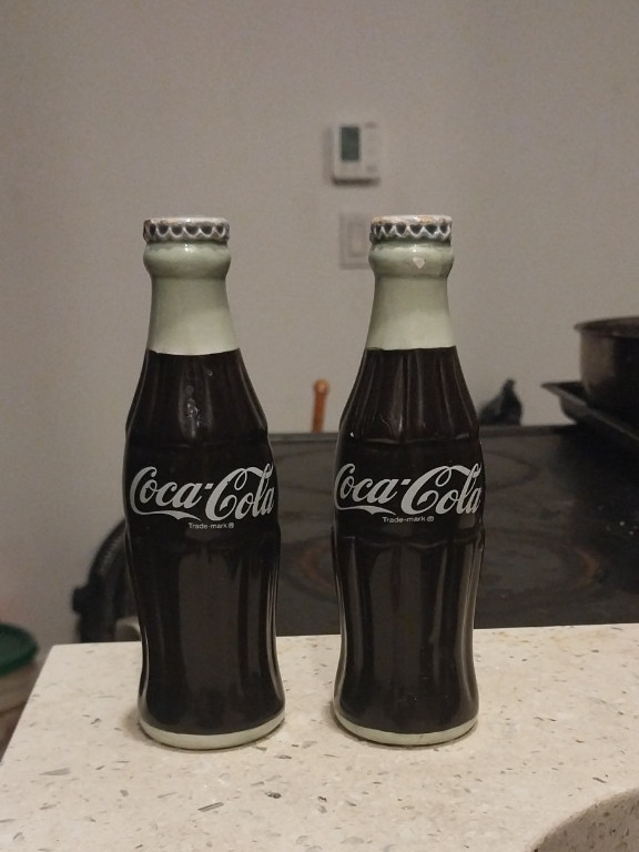 Ceramic Coca-Cola bottle salt and pepper shakers by The Coca-Cola Company
