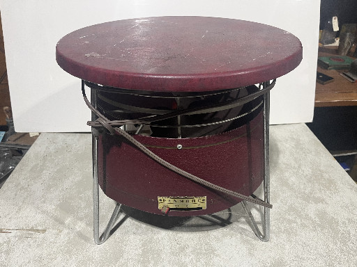 Vintage Kenmore Hassock Fan in burgundy metal with chrome wire cage
