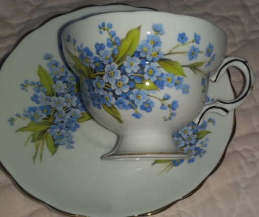 Bone china teacup and saucer with forget-me-not floral pattern