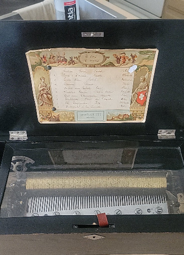 Swiss cylinder music box with inlaid wooden case, circa late 19th century