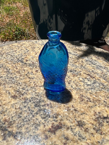 Blue glass bottle shaped as a fish, 'Doctor Fisch's Bitters' by Wheaton Glass