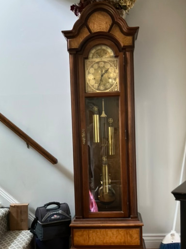 Mahogany grandfather clock with moon dial by Howard Miller