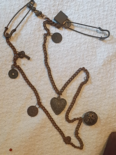 Vintage bronze-tone charm necklace with keys, heart, and coin charms