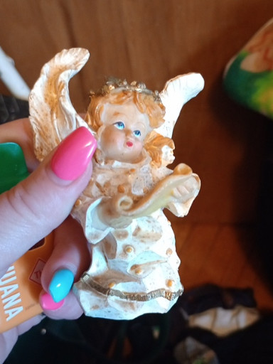 Polystone angel figurine with yellow bird