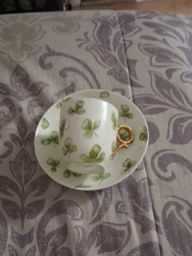Porcelain demitasse cup and saucer set with shamrock decoration by Haviland & Co., Limoges, France