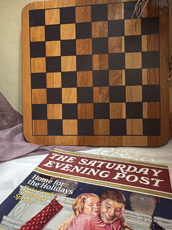 Wooden chess board with alternating light and dark wood squares