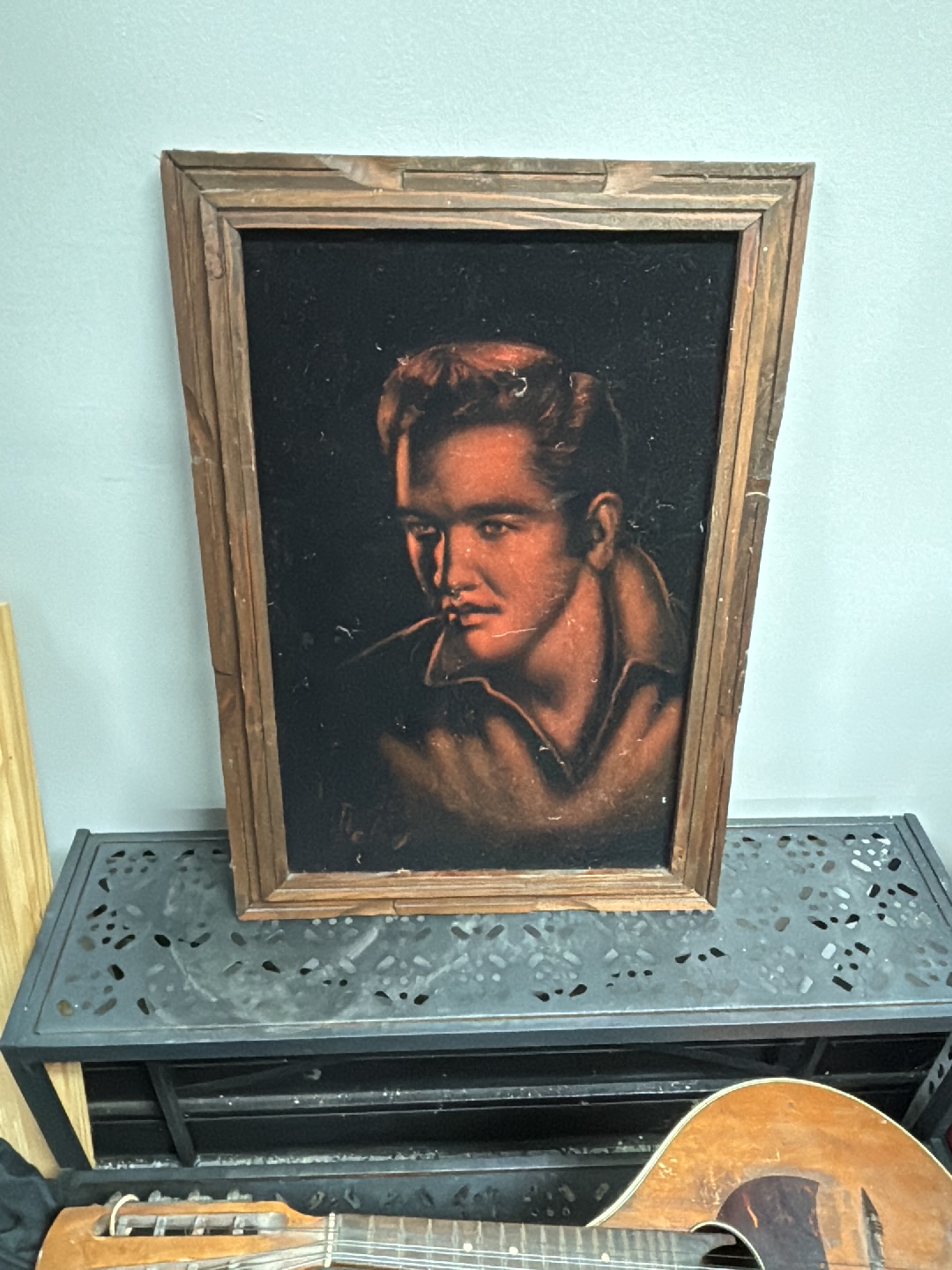 Velvet painting portrait of a musical icon in wooden frame