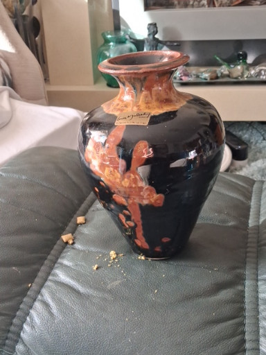 Stoneware vase with tenmoku-style glaze and orange drip decoration