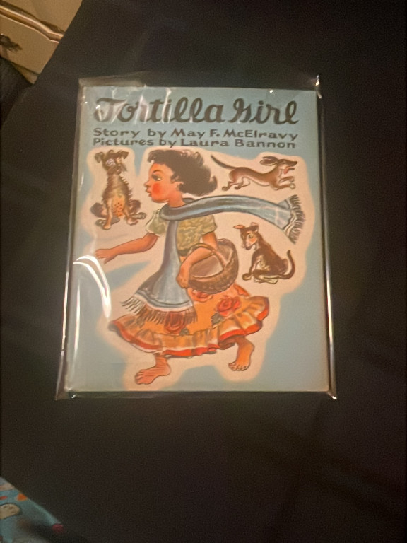 Children's book titled 'Tortillera' by May F. McElravy with illustrations by Laura Bannon