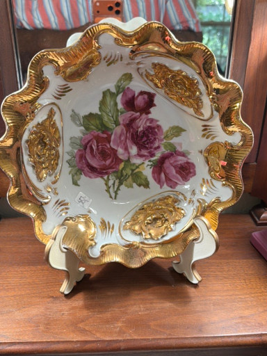 Porcelain decorative plate with hand-painted roses and gilt trim, possibly by Carl Tielsch & Co.