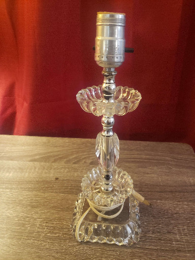 Clear pressed glass table lamp with tiered hobnail design and hanging crystal prisms