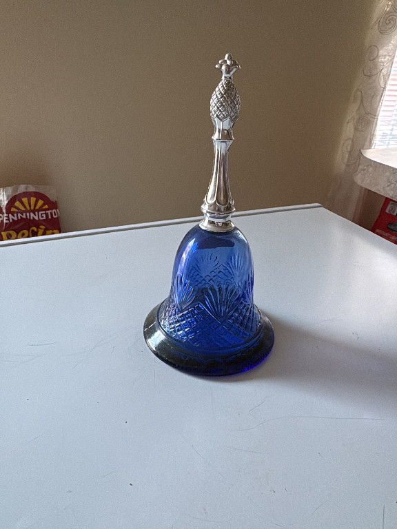 Cobalt blue glass bell-shaped perfume bottle with silver-tone handle by Avon