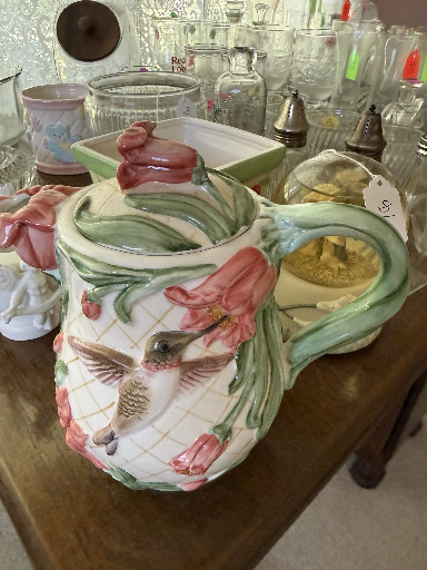 Ceramic pitcher with hand-painted floral and bird decoration