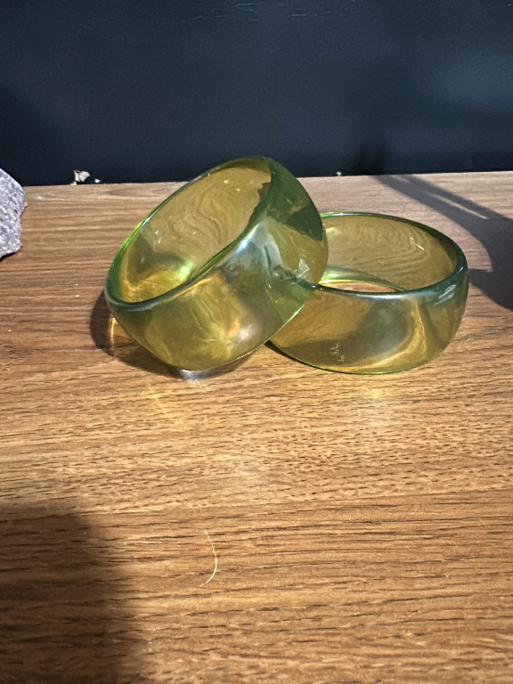 Pair of vintage lucite bangle bracelets in translucent olive green