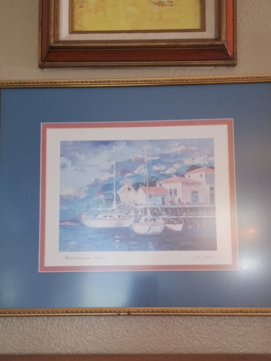 Watercolor print depicting a Mediterranean coastal scene with sailboats and white buildings
