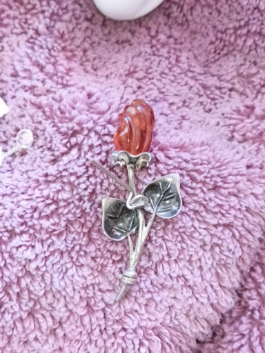 Sterling silver brooch with carved Baltic amber rose