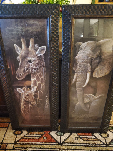 Framed art prints titled 'Love and Devotion' (giraffes) by Ruane Manning and elephant print