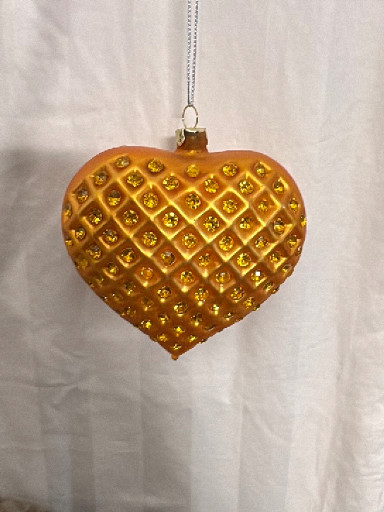 Hand-blown glass heart-shaped Christmas ornament with gold quilted diamond pattern and glitter accents