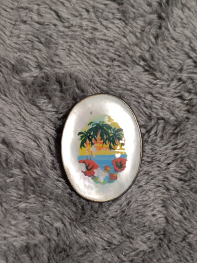 Sterling silver brooch with reverse-painted morpho butterfly wing depicting a tropical beach scene