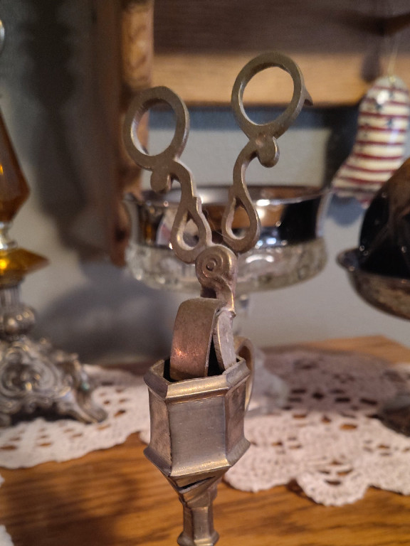 Brass candle snuffer with scissor-like mechanism
