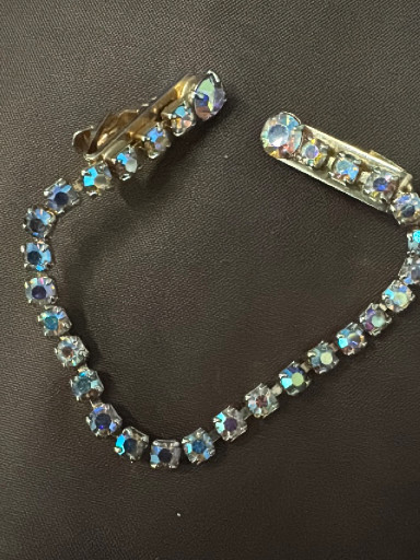 Vintage sweater clip with iridescent blue rhinestones