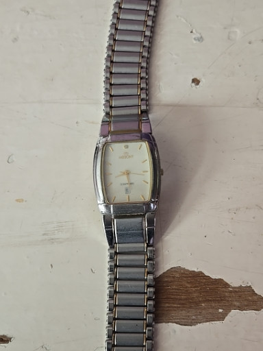 Stainless steel quartz wristwatch with rectangular case and expansion bracelet