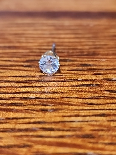 Sterling silver stud earring with round-cut blue topaz or aquamarine gemstone
