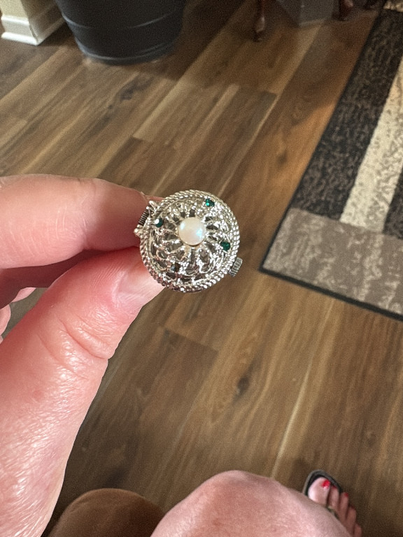 Silver-tone filigree ring with central pearl and colored stone accents