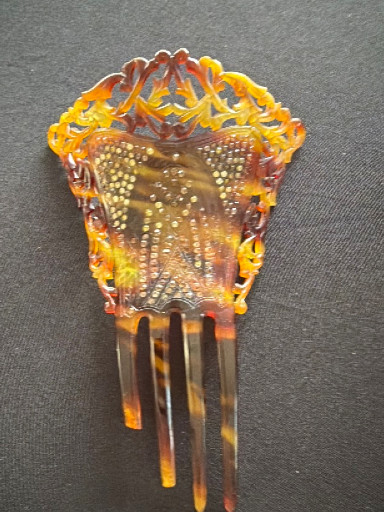 Faux tortoiseshell Victorian-era decorative hair comb with pierced design and rhinestone embellishments