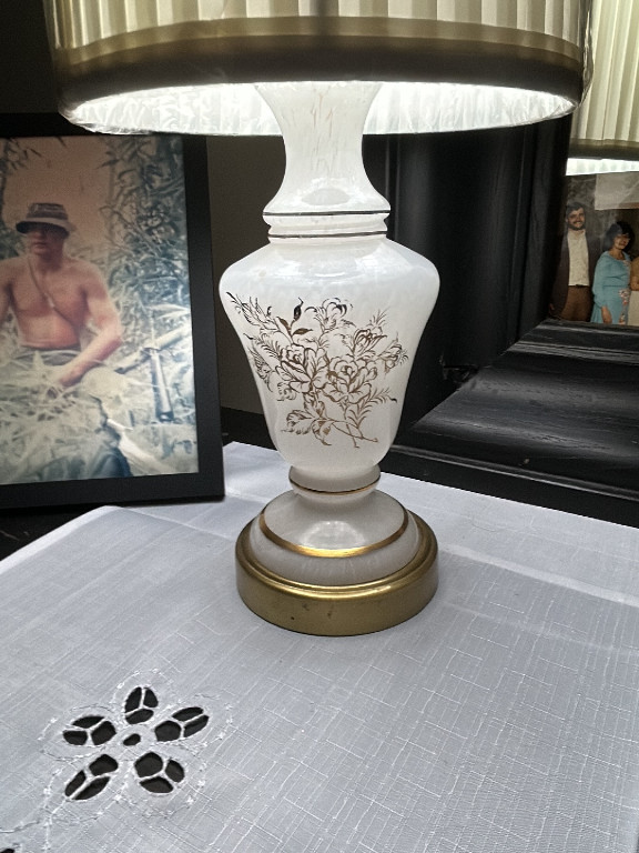 White opaline glass table lamp with gold floral design and brass base