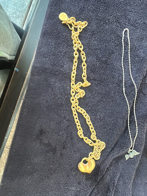 Gold-tone chain necklace with heart-shaped padlock pendant