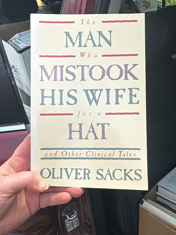 Book titled 'The Man Who Mistook His Wife for a Hat and Other Clinical Tales' by Oliver Sacks